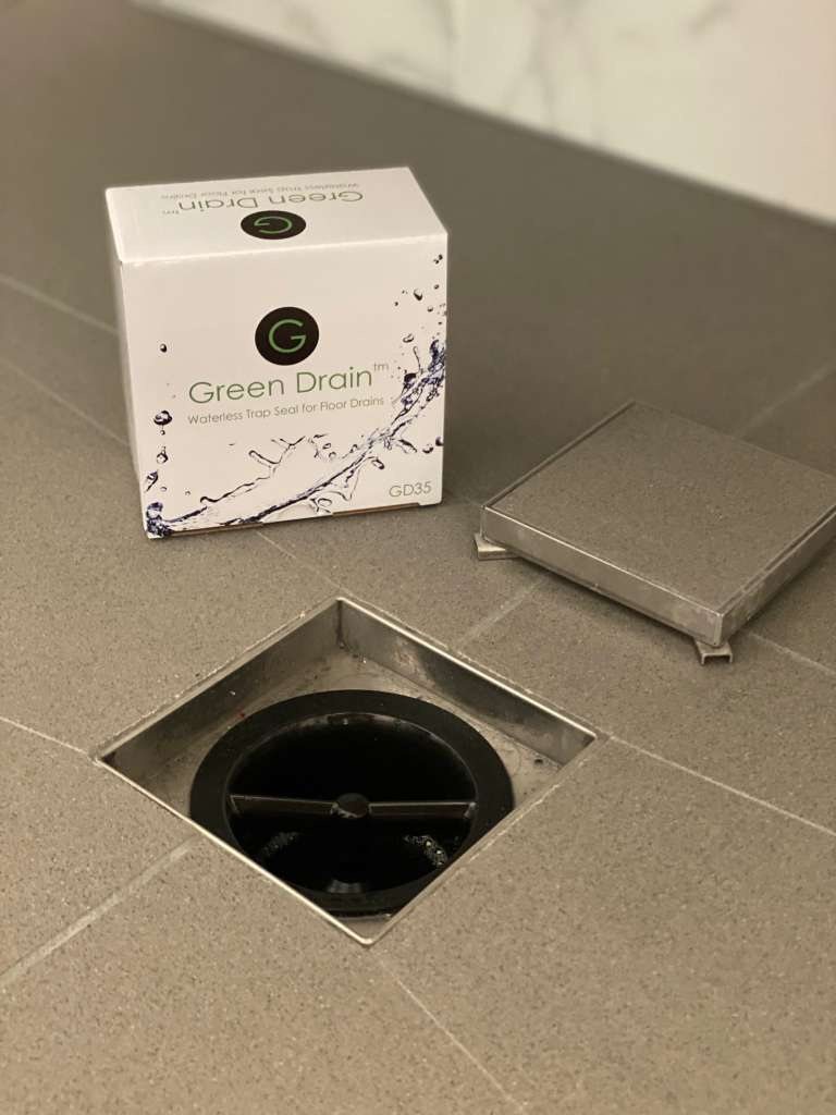 Green Drain in a square floor drain